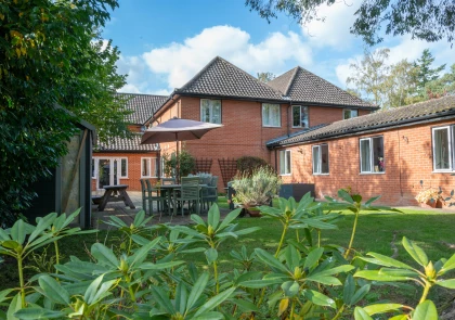 Take in the beautiful exterior view of Heron Lodge Care Homes, located in Wroxham